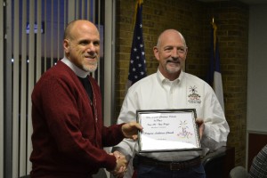 Pastor Galler receives the certificate for the Pilgrim float from Chamber of Commerce President Mike Coston. Photo: James Draper, Kilgore News Herald