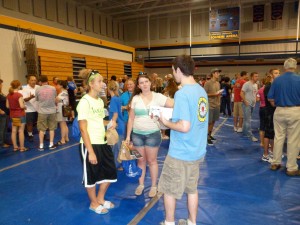 Pilgrim member George C. Heil talks to two of the more than 450 new LeTourneau students at the University’s 2012 Church Fair. Pilgrim’s booth, sponsored by the congregation’s then Missions and Evangelism Committee, also offered bottled water, homemade cookies, ink pens, spiral notepads, and church brochures.