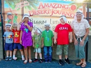 2012 VBS Storyteller Barbara Wuthrich (far right) poses with her students wearing their desert headgear.