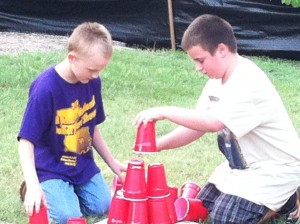 Like any good VBS, Pilgrim’s included time each night for the children to play outside. Steven Sampson and Tim Jeffers led them in games that related to the main Bible story for the day. Here, on the first night, John Morton and Clay Ellis build a tower of cups that helped recall the Tower of Babel told of in Genesis 11:1-9.