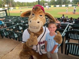 Pilgrim Member Cooper Sampson poses with Boomer, the East Texas Pump Jacks mascot named for the city's oil boom, at the July 2012 Once-a-month Social Outing. 