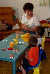 Longtime Sunday School teacher Sharon Sampson begins the August 5 Pre-Kindergarten class by forming the lesson theme out of Play-Doh.