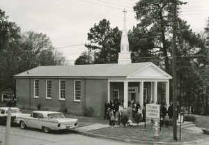 The saints of Pilgrim Lutheran Church congregate outside the sanctuary after a service in the early 1960s. (The pull-in parking off Broadway and Florey present today was added some 20 years later.)