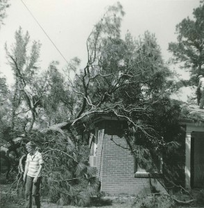 In the 1960s, member Larry Hudson (lower left) and his member father, Glenn Hudson (upper right), survey the damage to the original church building after a tree fell over on it during a storm, largely impacting what was then Pastor Wageman’s study (the current kitchen).