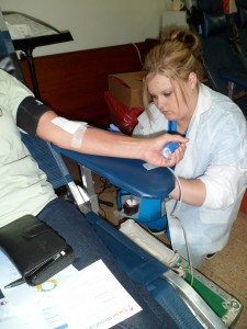 A Carter BloodCare phlebotomist checks the flow of blood from one of the donors at the October 12, 2013, Kilgore Community Blooddrive. Each unit of whole blood can touch three lives!