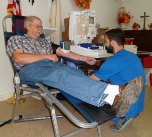 Longtime Kilgore Rotarian Bob Miracle is the first donor of the October 12, 2013, blood drive. Bob donated two units of red cells, what 90% of recipients are said to need most.