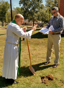 Pilgrim's Pastor Jayson S. Galler makes the sign of the cross as part of the groundbreaking for the congregation's new Parish Hall. Capital Improvement Committee Chair Steven Sampson assists. Photo: Paul Guinn.