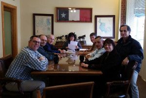 From left are Steven Sampson, David Navaille, Edgar Wuthrich, the title company representative, Brady Gage, Danny Sampson, Kathy Hudson, and Remo Gualtieri. (Thanks go to the title company staff member who took the picture.)