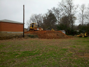 A crew and equipment from Roll'n M Construction level the pad for the new Parish Hall the week of January 10, 2016. Photo: Gayle Gardner.