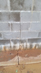This March 22, 2016, photo shows one of the cracks that appeared in the foundation wall for the new Parish Hall.  Photo: J. Galler.